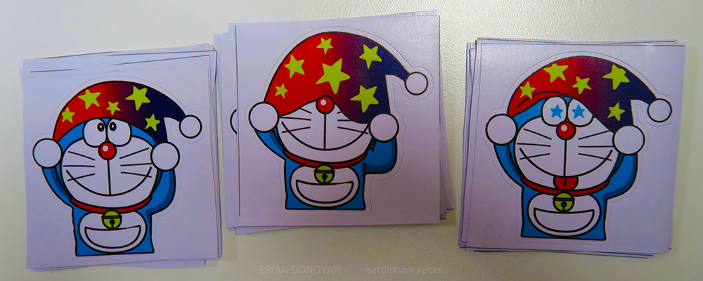Stickers featuring Doraemon wearing a star-studded sleeping cap or wizard hat.