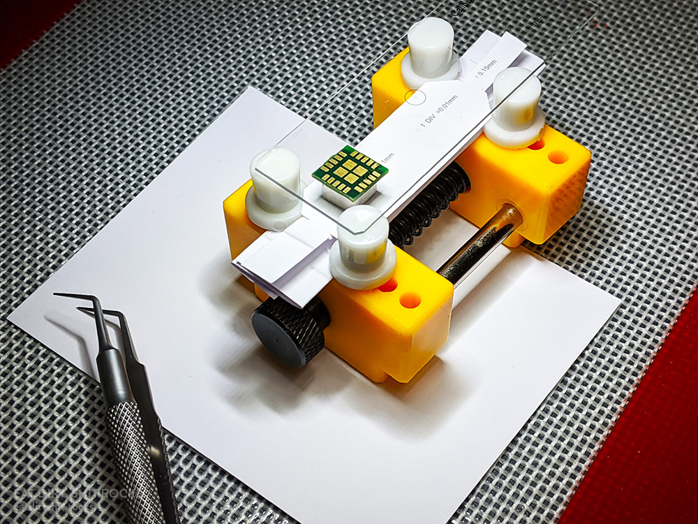 My setup for these photos utilized a mini PCB vise and some heavy notecard paper, cut to shape.