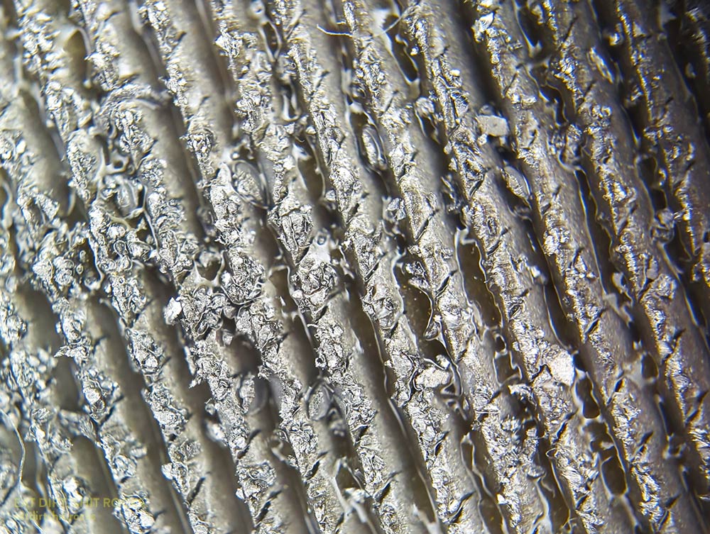 The surface of the flat side of the file, after I'd put it to use but before I'd cleaned off the stainless steel crumbs.
