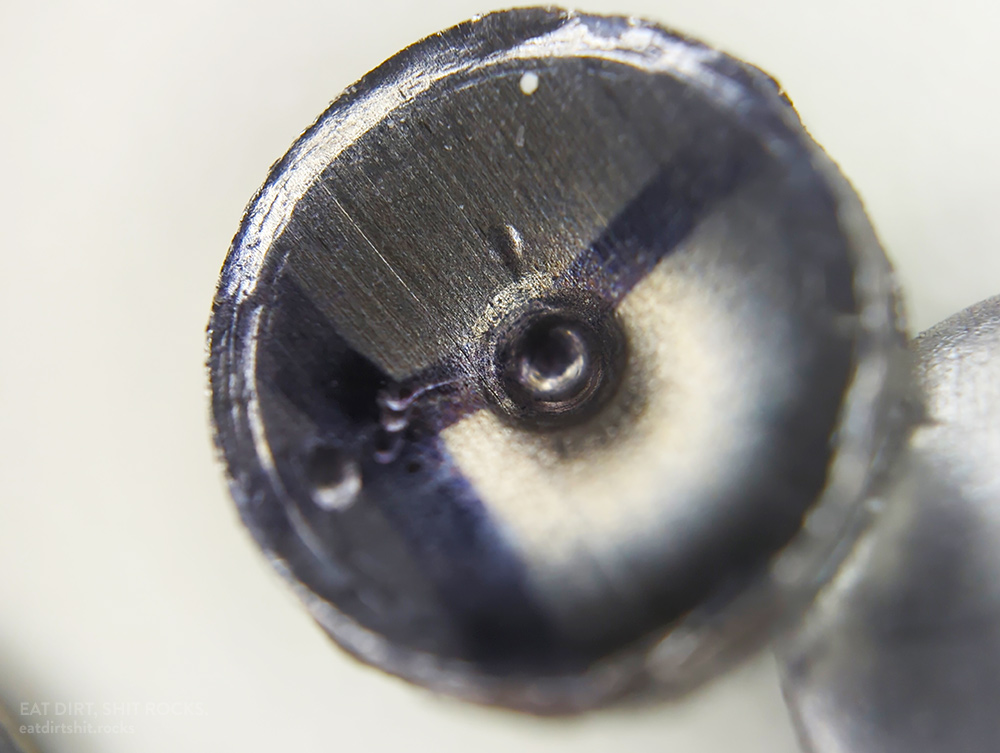 A close-up of a different concave-oriented 304 stainless steel confetto.